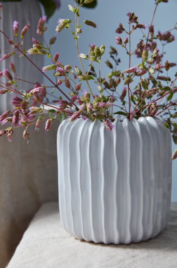 Textured tabletop vase with a tactile surface